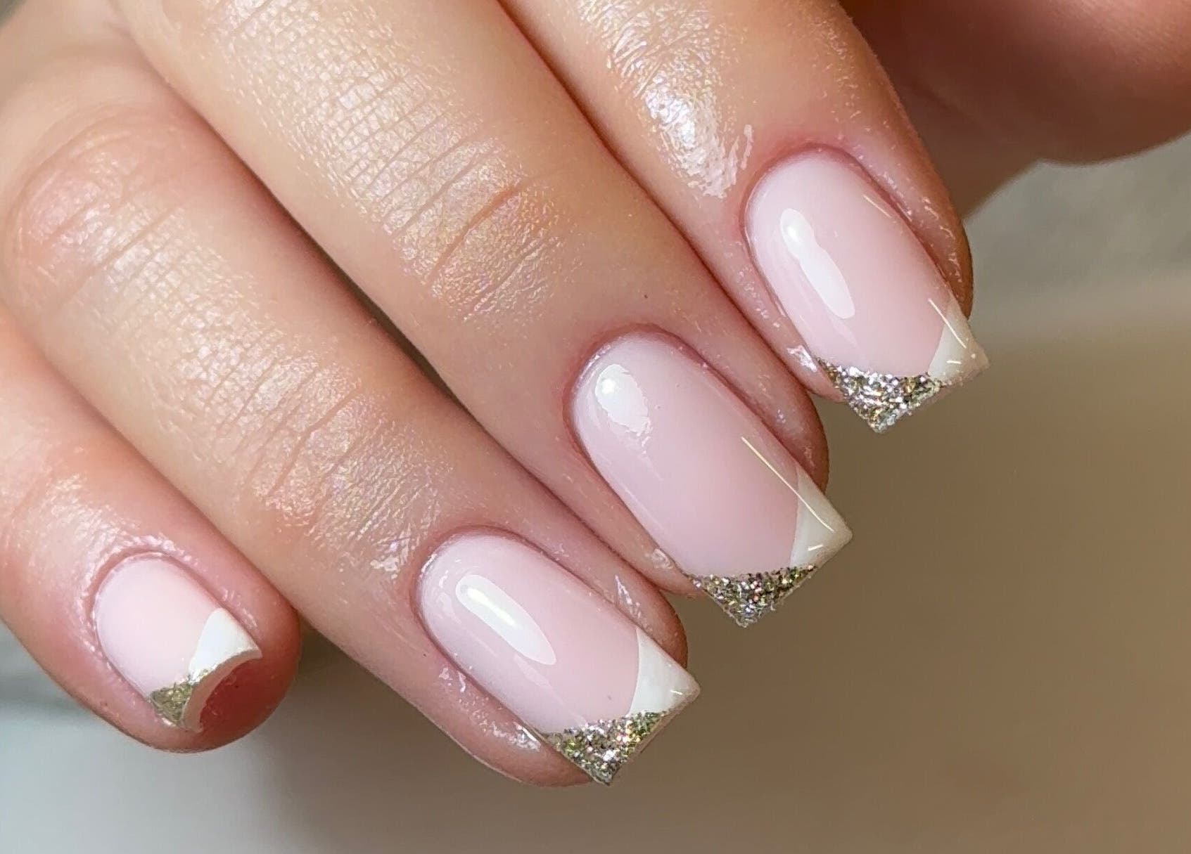 Elegant manicured nails with glitter tips at Amethys at The Granary, Polesworth, England, GB.