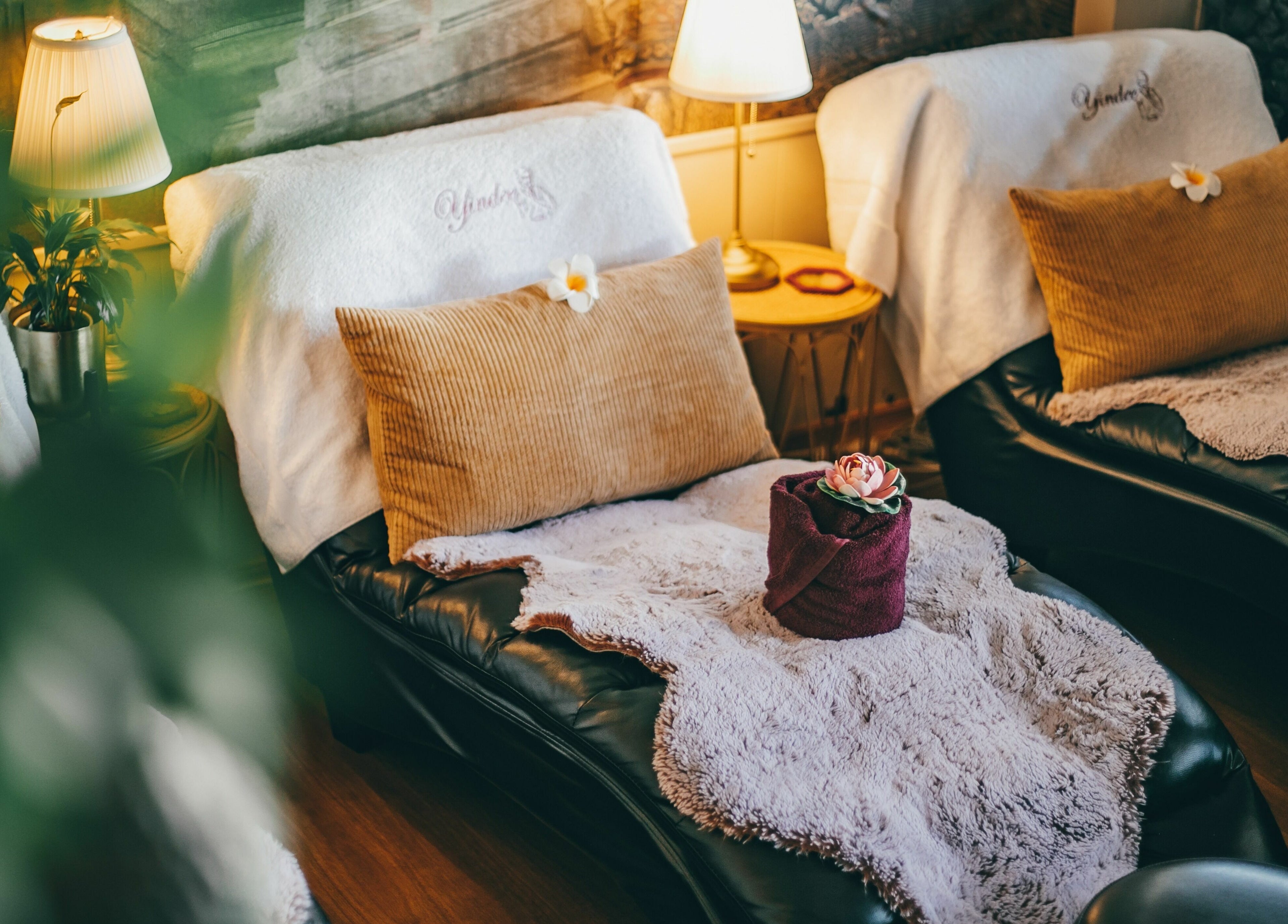Relaxing lounge at Yindee Thai Massage Broadbeach, Queensland, AU with cozy towels and ambient lighting.