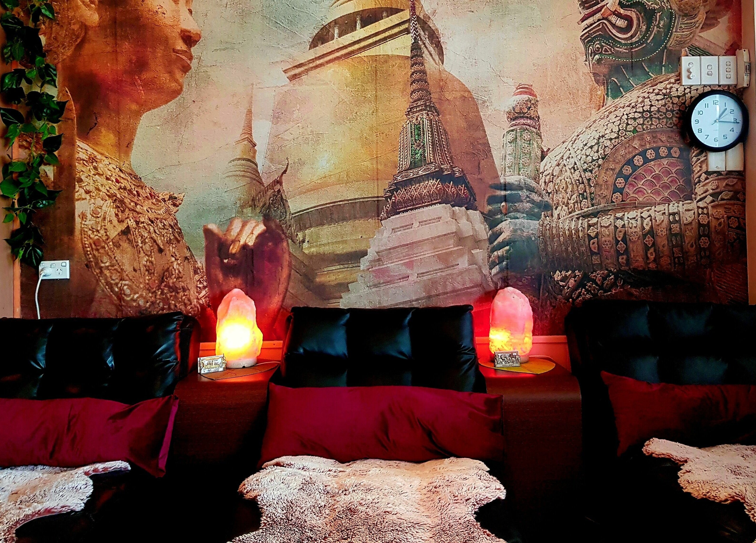 Relaxing massage chairs at Yindee Thai Massage Broadbeach, Broadbeach, Queensland, AU with Thai decor backdrop.