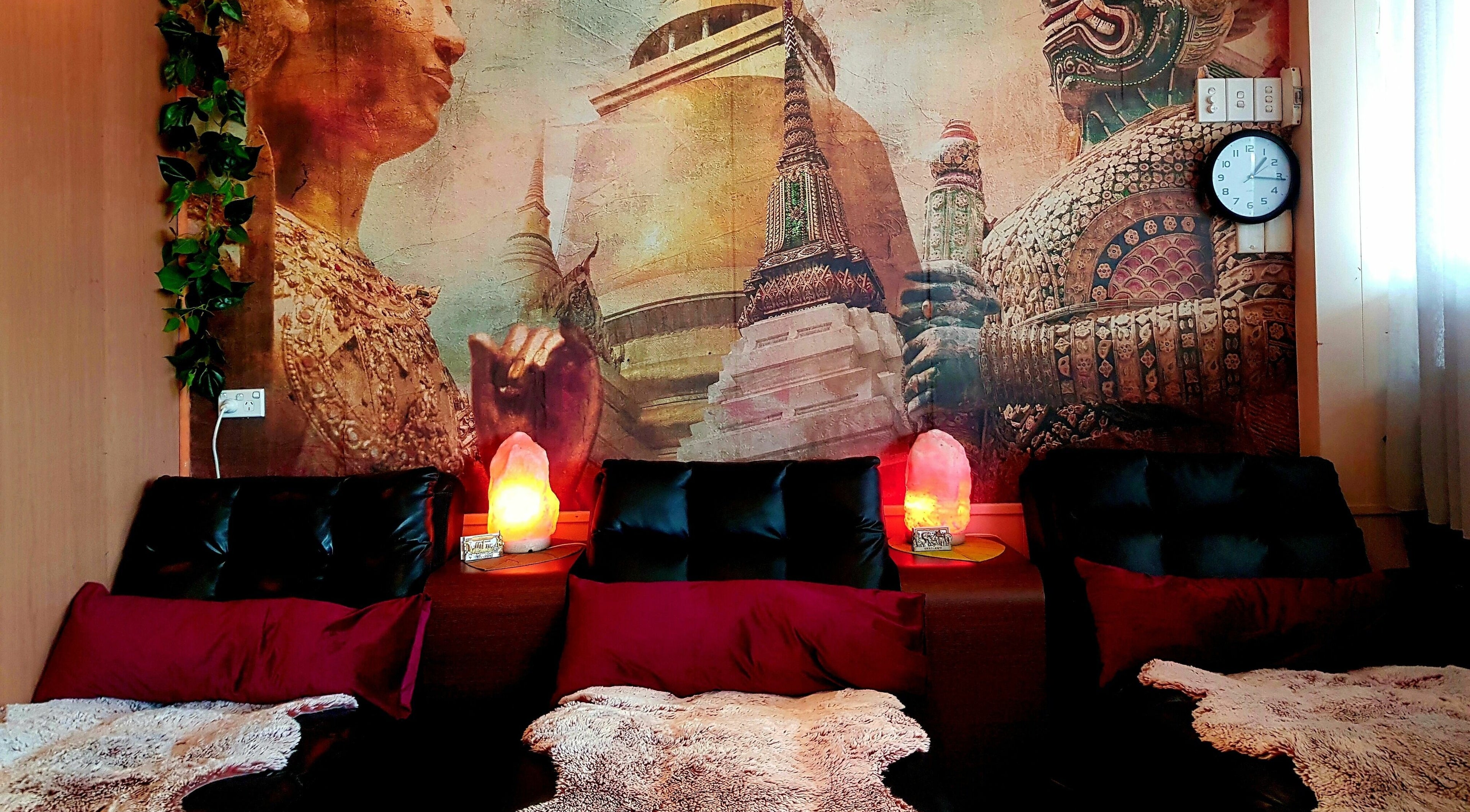 Relaxing massage chairs at Yindee Thai Massage Broadbeach, Broadbeach, Queensland, AU with Thai decor backdrop.