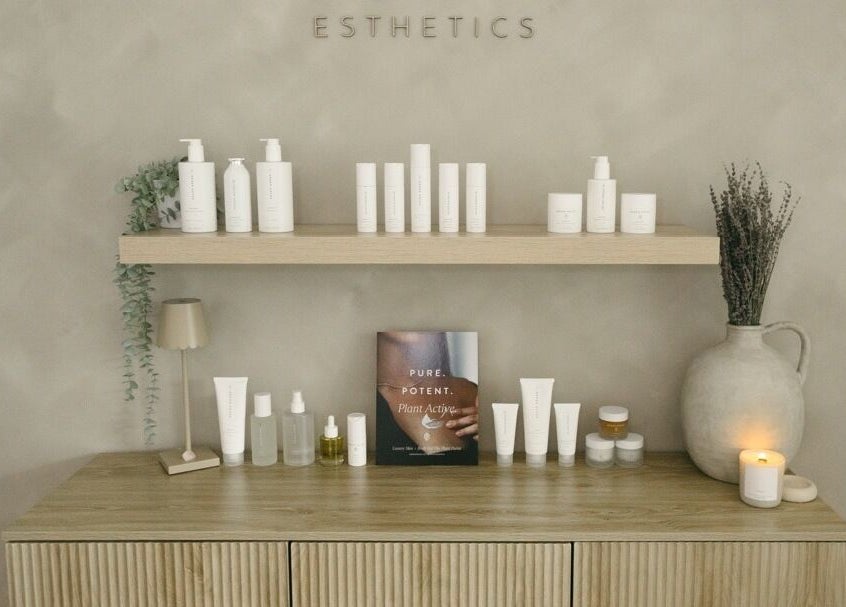 Elegant shelf with beauty products at Brittney Finch Esthetics, Ottawa, Ontario, CA. Modern and serene setup.