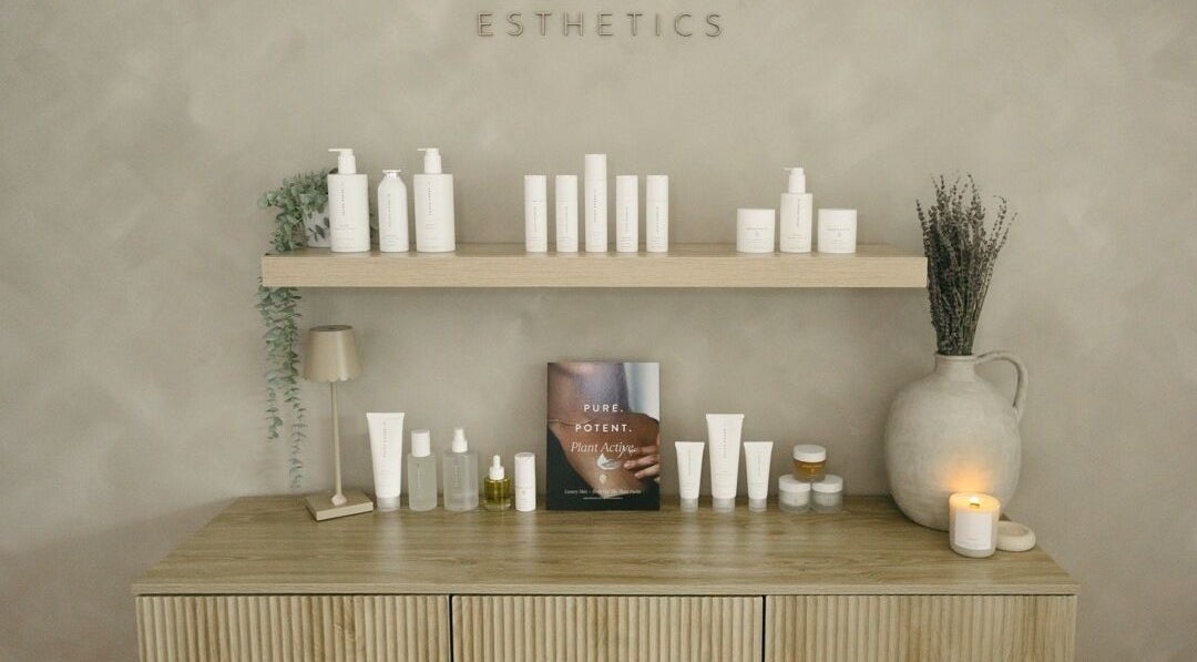 Elegant shelf with beauty products at Brittney Finch Esthetics, Ottawa, Ontario, CA. Modern and serene setup.