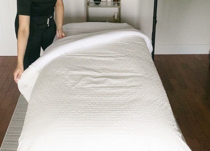 A relaxing treatment bed at Brittney Finch Esthetics, Ottawa, Ontario, CA, ready for a rejuvenating session.
