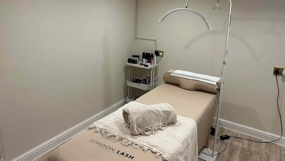 Tranquil spa room at Be Beau Boutique, featuring a massage bed and soothing decor in Paignton, England, GB.