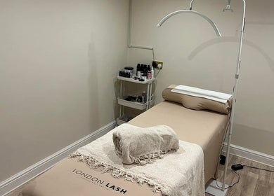 Tranquil spa room at Be Beau Boutique, featuring a massage bed and soothing decor in Paignton, England, GB.