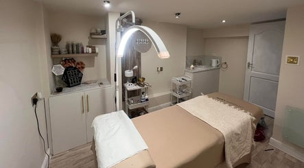 Calming treatment room at Be Beau Boutique in Paignton, England, GB, featuring a cozy massage table and ambient lighting.