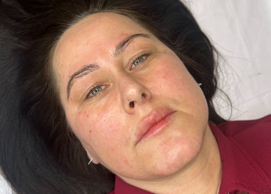 Client enjoying facial treatment at Faceology - Hythe, located in Hythe, Lympne, England, GB.