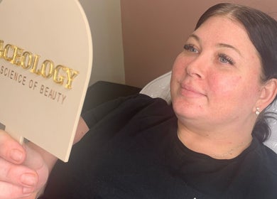 Client admiring results at Faceology - Hythe, located in Hythe, Lympne, England, GB.