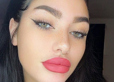 Close-up of a woman's makeup at Faceology - Hythe, Hythe, Lympne, England, GB. Elegant eyeliner and bold lips.