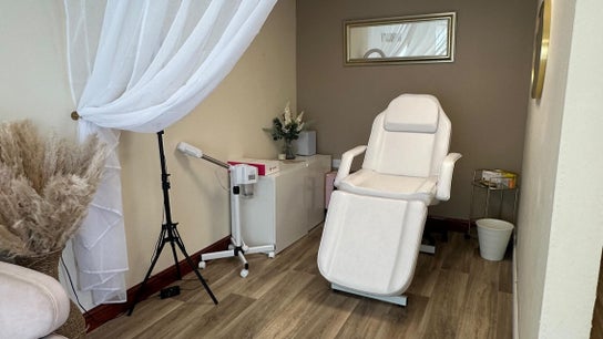 Elegant treatment room at Faceology - Hythe, Hythe, Lympne, England, GB with plush chair and soft lighting.