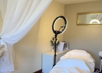 Relaxing treatment room at Faceology - Hythe in Hythe, Lympne, England, GB, featuring elegant decor and ambient lighting.