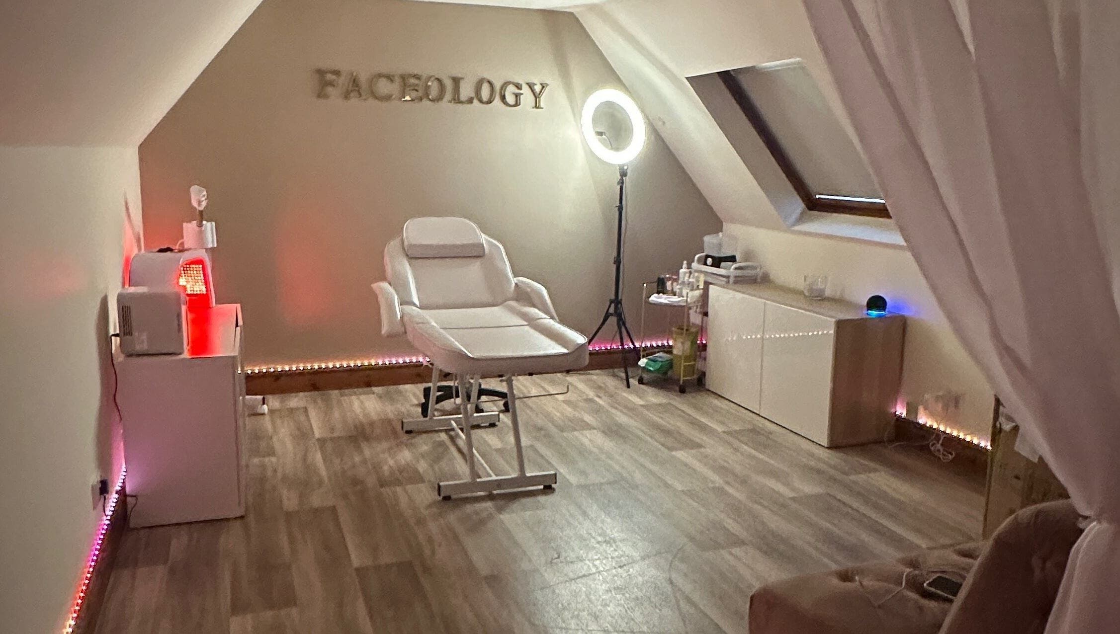 Faceology treatment room in Lympne, Hythe, England, GB. Featuring a comfortable spa chair and ambient lighting.