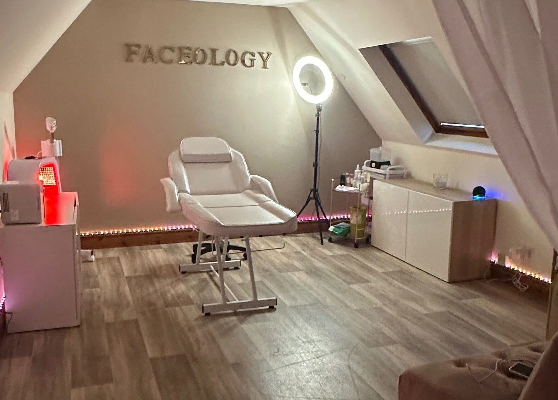 Faceology treatment room in Lympne, Hythe, England, GB. Featuring a comfortable spa chair and ambient lighting.