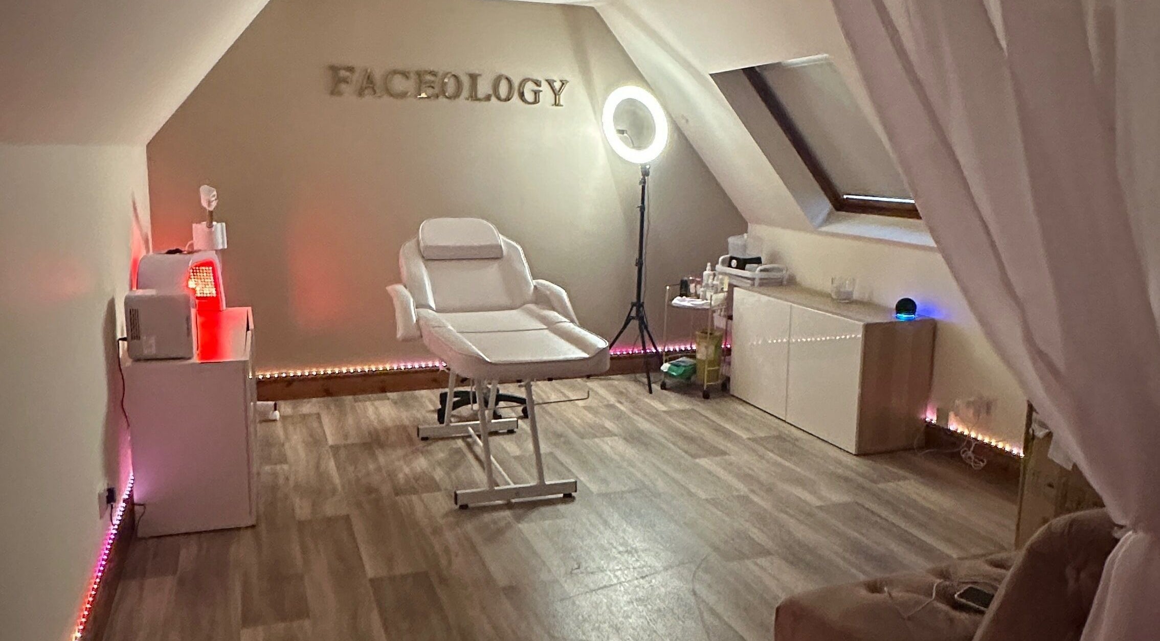 Faceology treatment room in Lympne, Hythe, England, GB. Featuring a comfortable spa chair and ambient lighting.