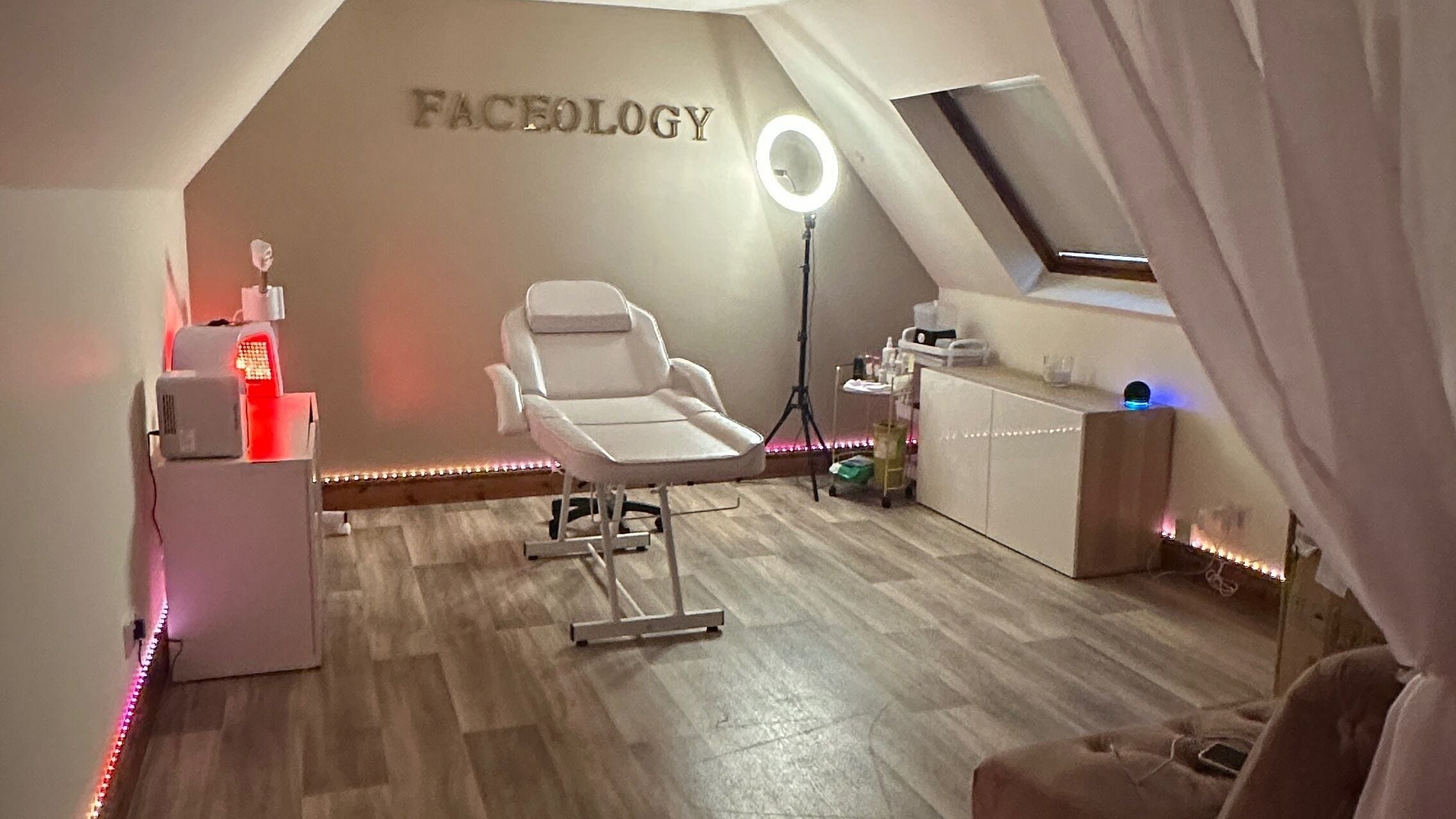Faceology treatment room in Lympne, Hythe, England, GB. Featuring a comfortable spa chair and ambient lighting.