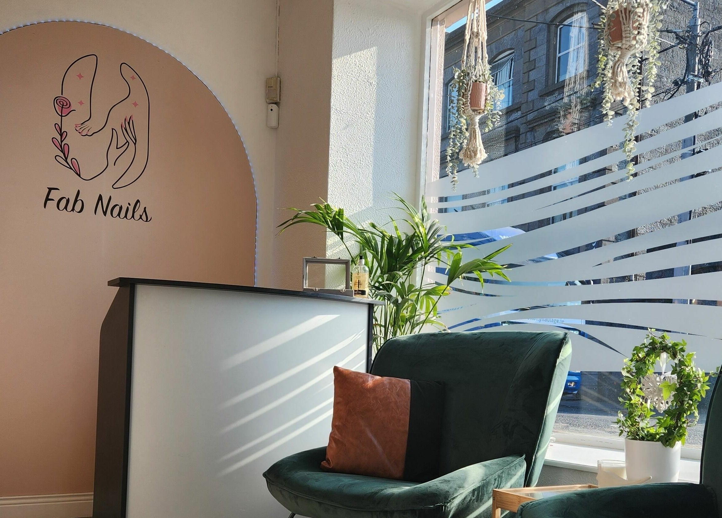 Reception area of Fab Nails Thurles in Thurles, County Tipperary, IE with elegant decor and natural light.