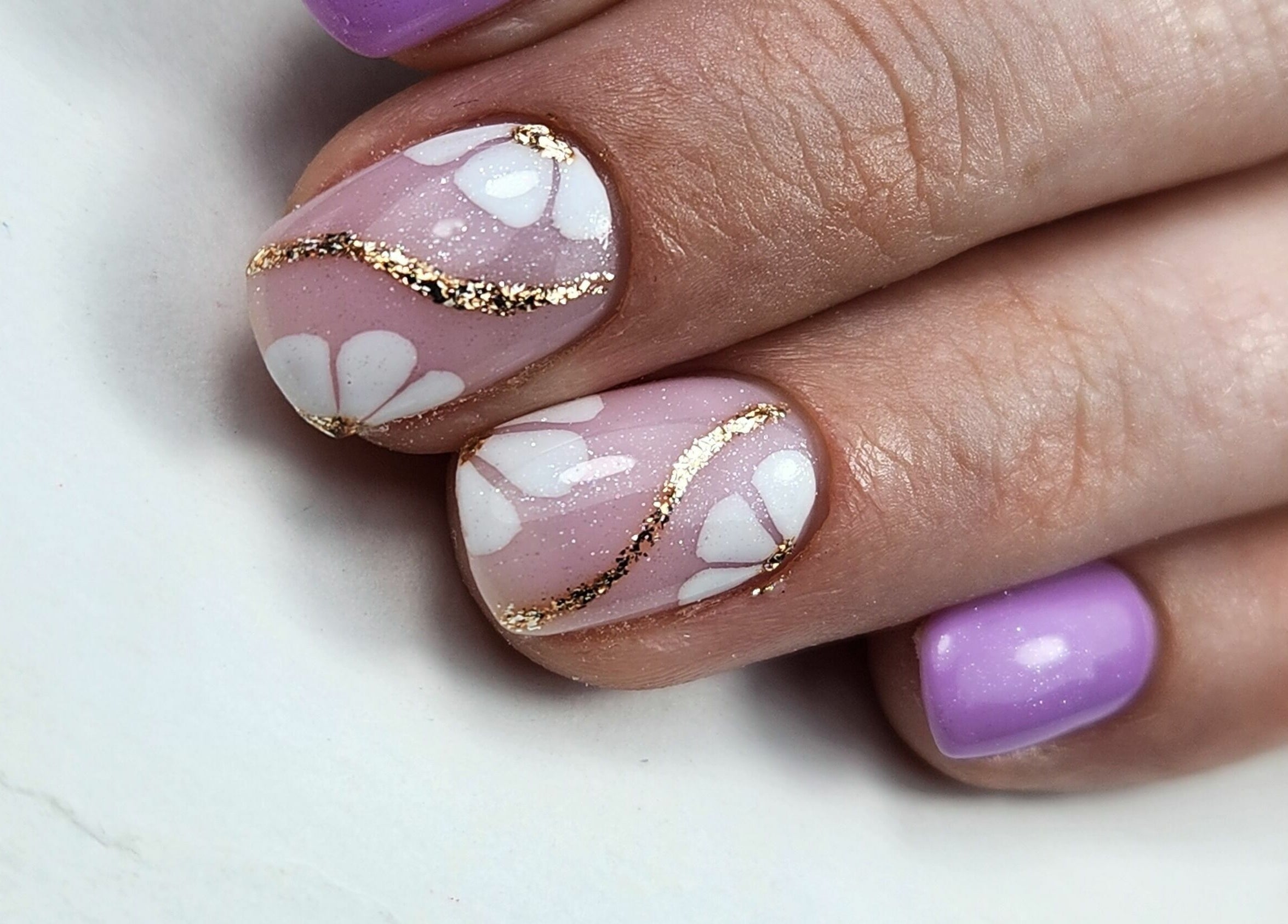 Beautiful floral nail art with purple polish at Fab Nails Thurles, Thurles, County Tipperary, IE.