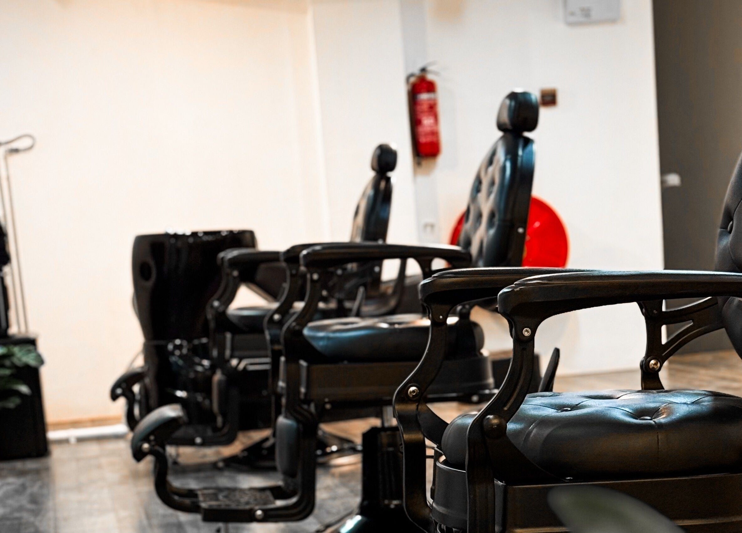 Luxury barber chairs at Mane Of Man, Singapore, Singapore, SG, showcasing modern salon design.