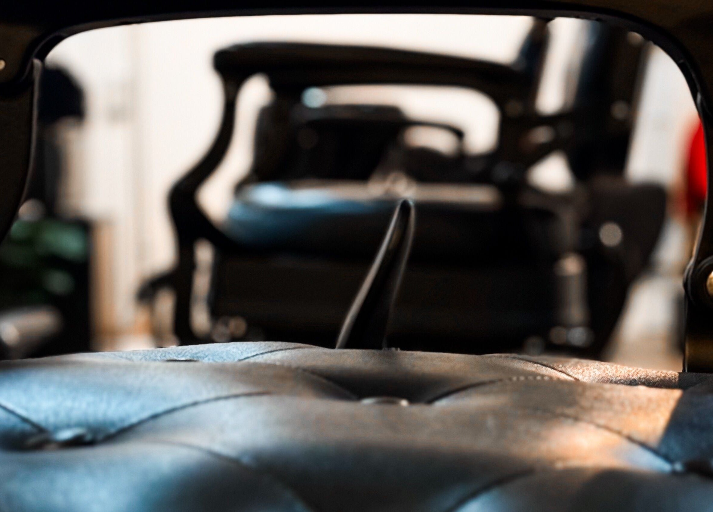 Luxurious barber chairs at Mane Of Man, Singapore, SG, showcasing premium leather craftsmanship.