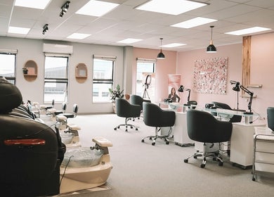 Elegant nail salon at Beautique Nails and Aesthetics & Co Ltd, Taupō, Waikato, NZ with stylish decor and seating.