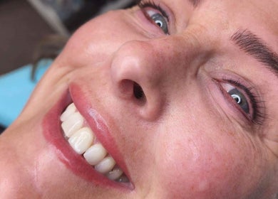Close-up of a smiling client's face after treatment at Beautique Nails and Aesthetics & Co Ltd, Taupō, Waikato, NZ.