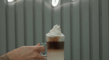 Delicious layered coffee with whipped cream at Shine by Bre, Orlando, Florida. Follow @shinebybre on Instagram.