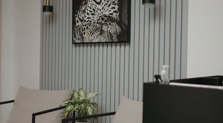 Modern lounge area at Shine by Bre, Orlando, Florida, US with elegant decor and a leopard art piece.