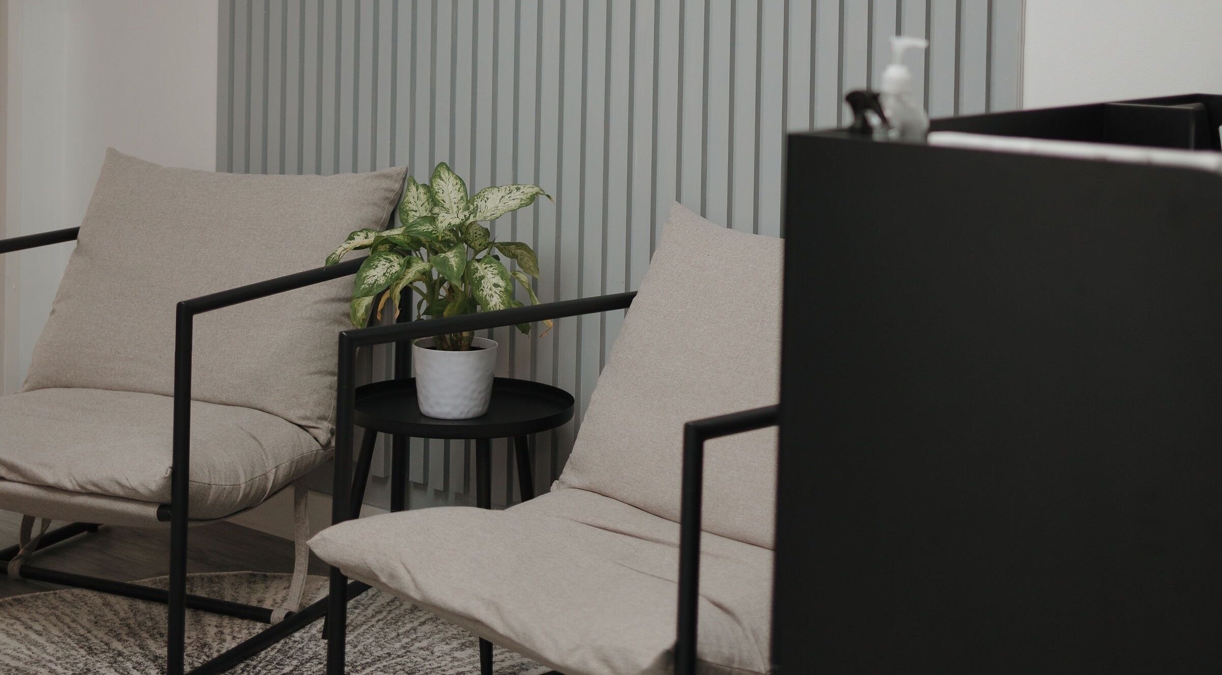 Elegant seating area at Shine by Bre in Orlando, Florida, US with potted plant and modern decor.