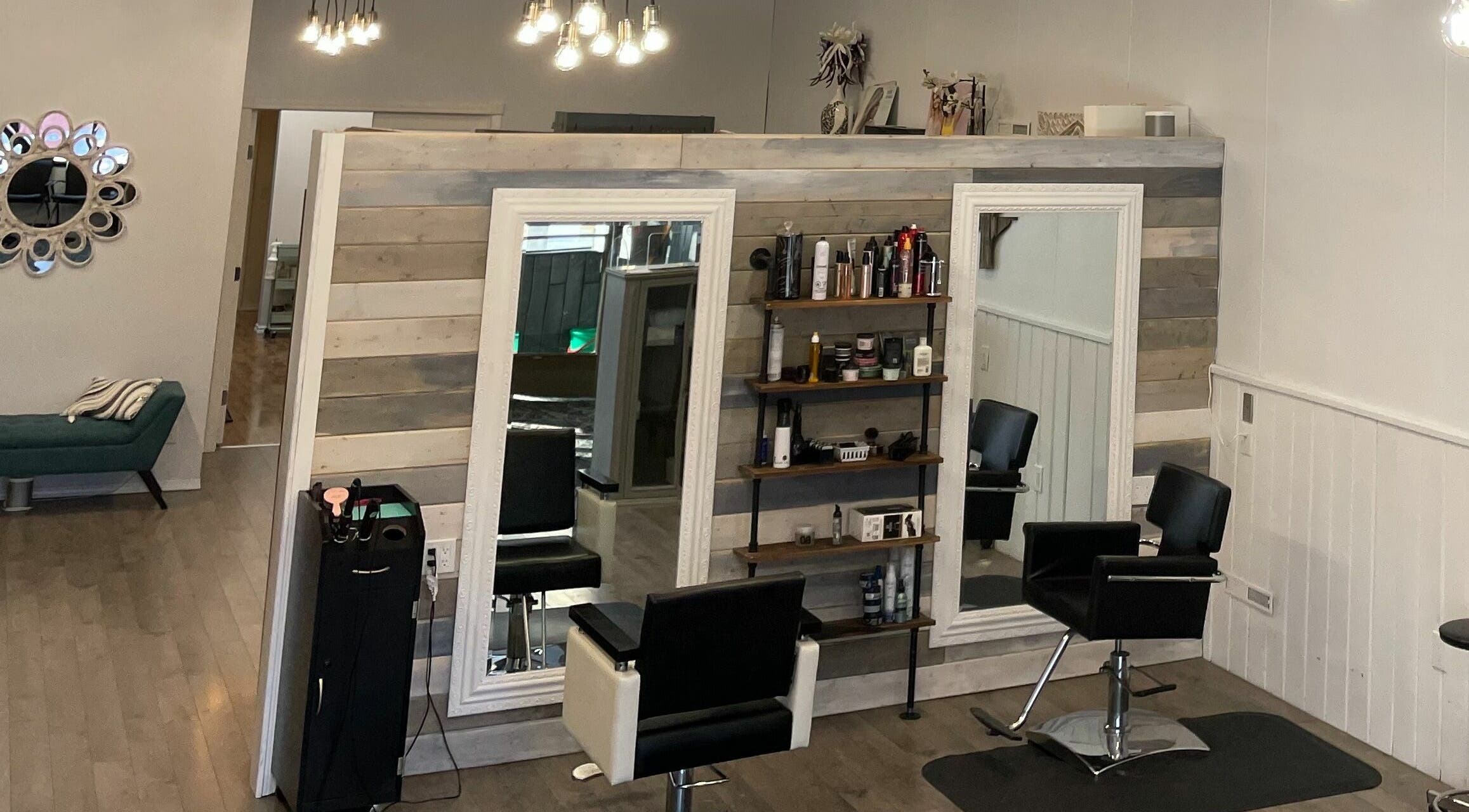 Modern styling area at Danello Salon and Esthetics Melville in Melville, Saskatchewan, CA featuring large mirrors.