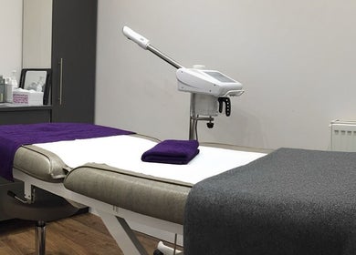 Relaxing treatment room at Saiqs Hair and Beauty, London, England, GB with plush towels and modern equipment.