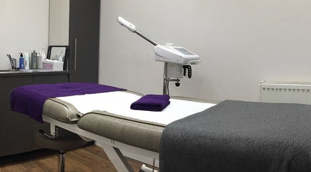 Relaxing treatment room at Saiqs Hair and Beauty, London, England, GB with plush towels and modern equipment.