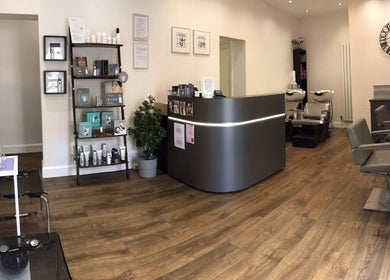 Reception and hair stations at Saiqs Hair and Beauty in London, England, GB showcasing modern decor and ambience.