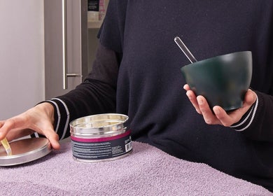 Professional at Saiqs Hair and Beauty, London, England, GB, preparing beauty treatment essentials.