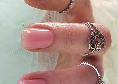 Manicured hand with elegant rings at Agnes Beauty Haven, Westhill, Scotland, GB.