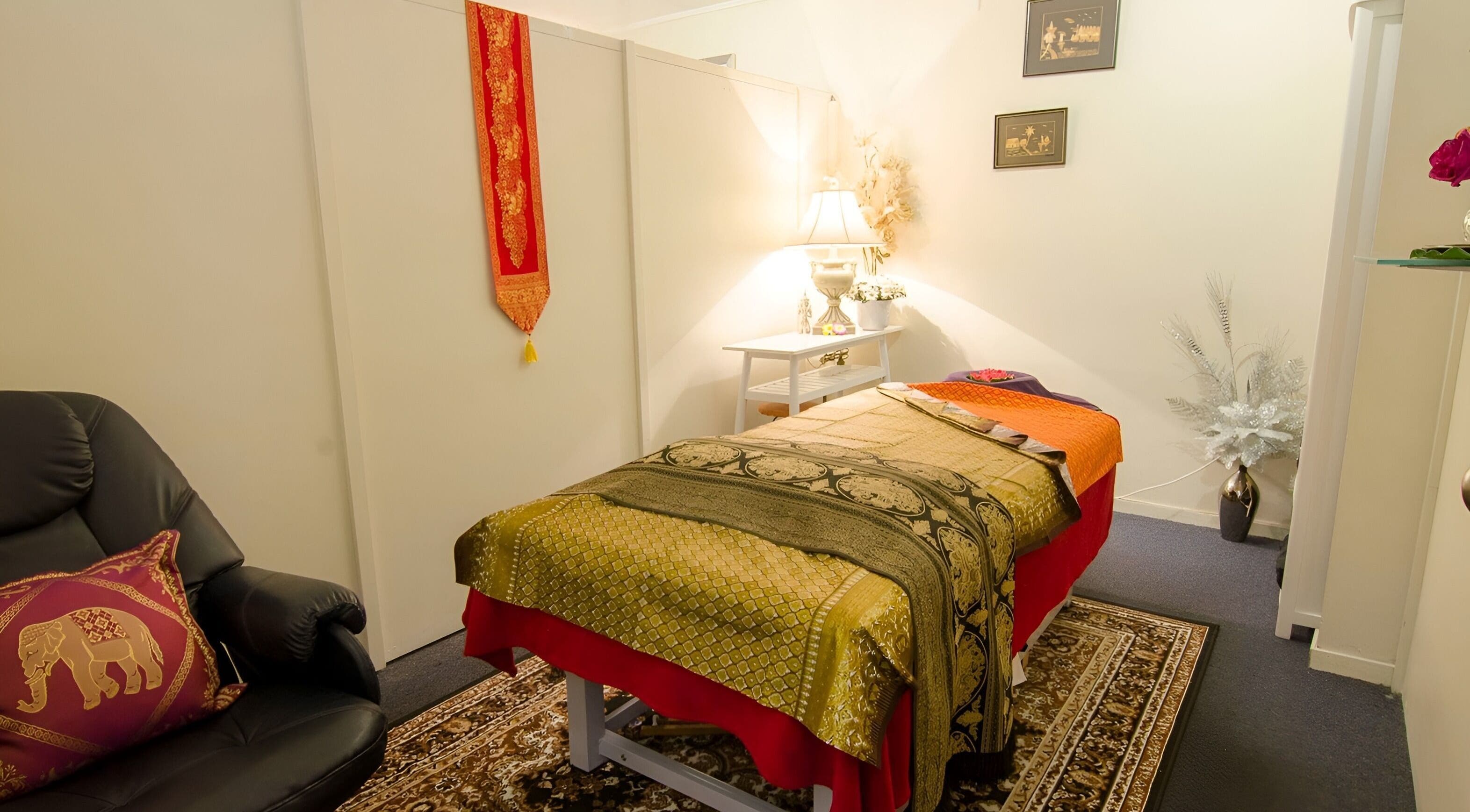 Cozy massage room at Iyra Thai Massage - Orewa, Auckland, NZ, featuring traditional decor.