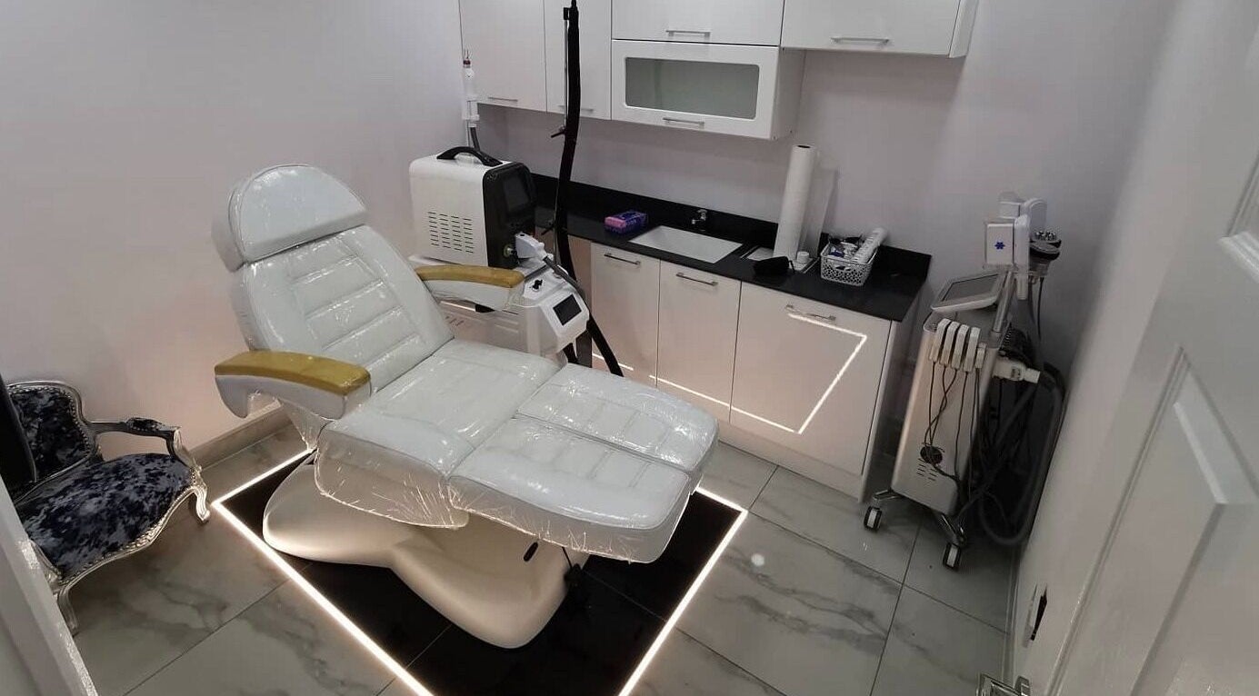 Velashine Beauty and Aesthetic Clinic, Peterborough, England: Modern treatment room with equipment and sleek decor.