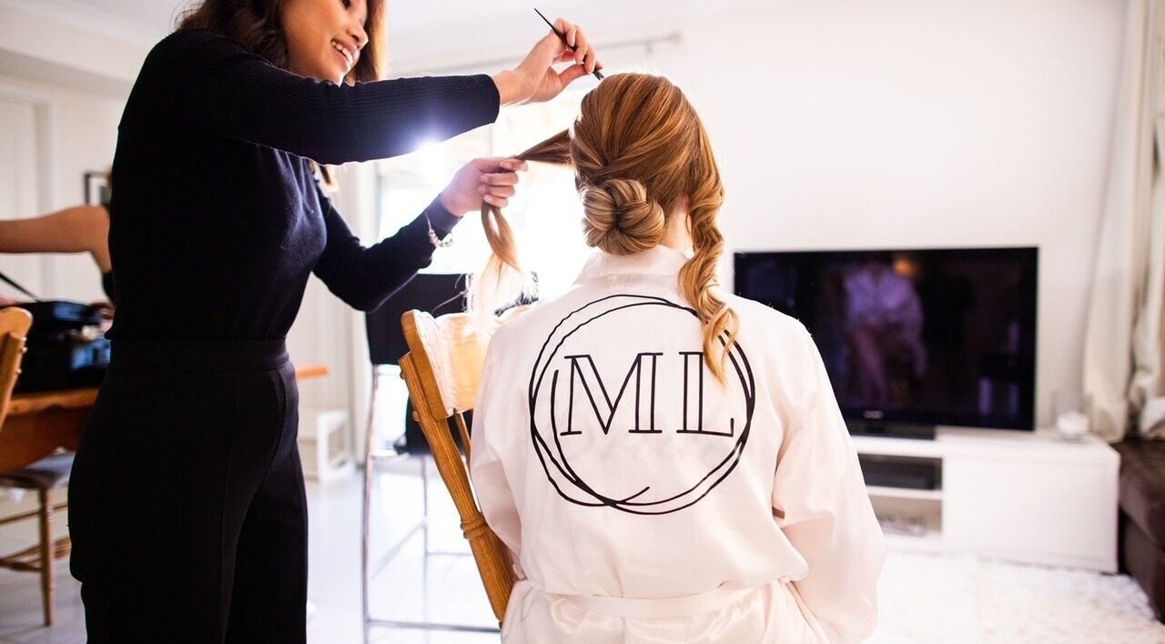 Marie Le Hair & Makeup Artist in Upper Mount Gravatt, Queensland, AU, crafting a bridal hairstyle with precision.