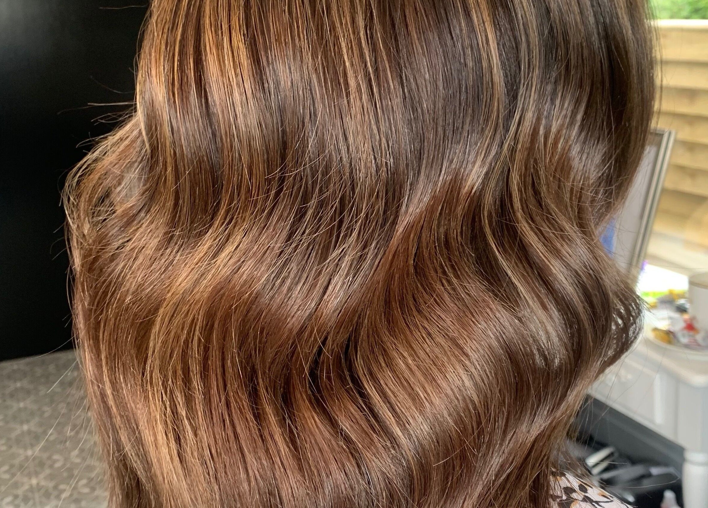 Glossy brown waves hairstyle at Hair At 25 salon in Dungannon, Northern Ireland, GB.