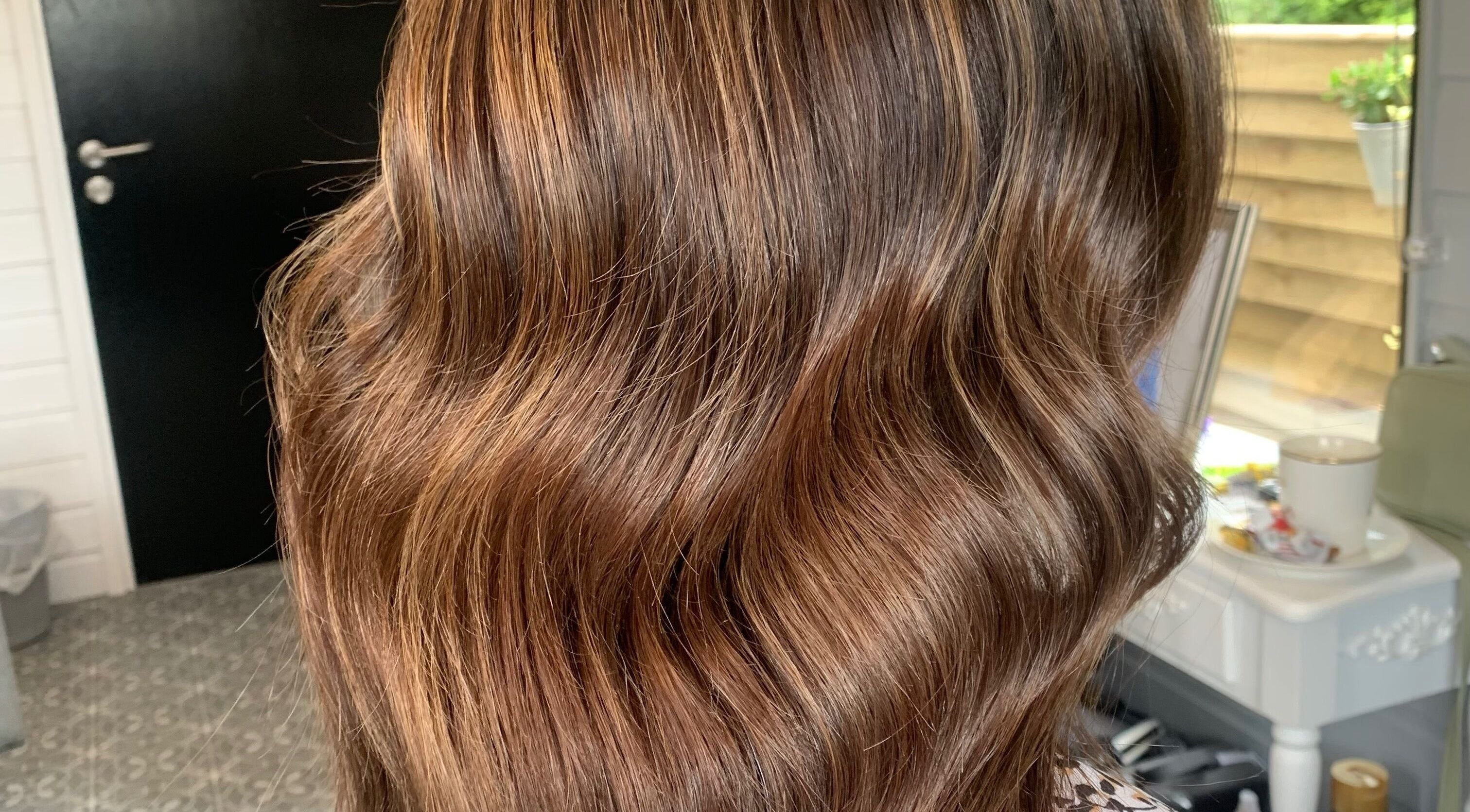 Glossy brown waves hairstyle at Hair At 25 salon in Dungannon, Northern Ireland, GB.