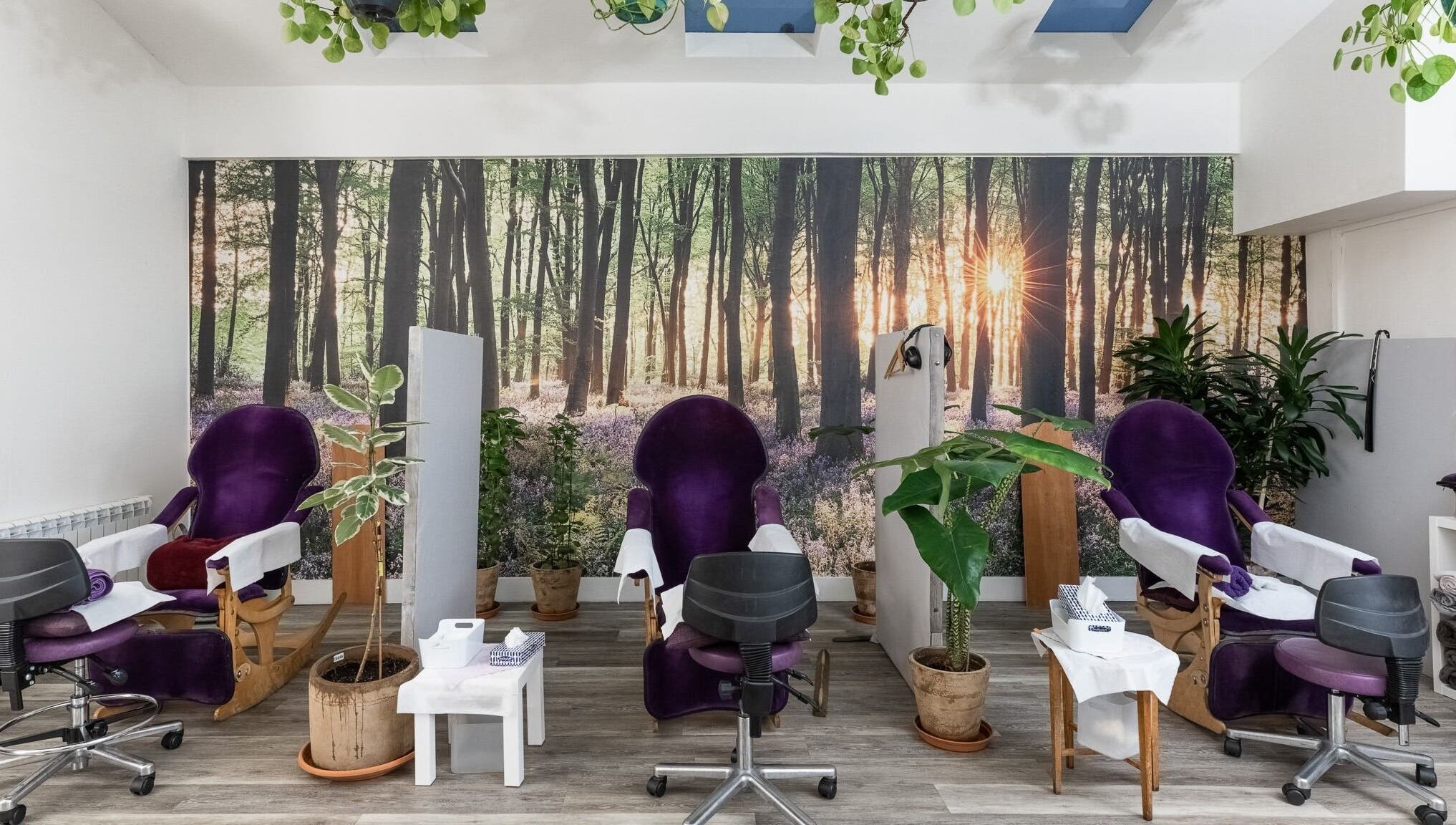 Relaxing spa chairs at Reflexions Bayswater, London, England, GB. A forest-themed beauty and wellness setting.