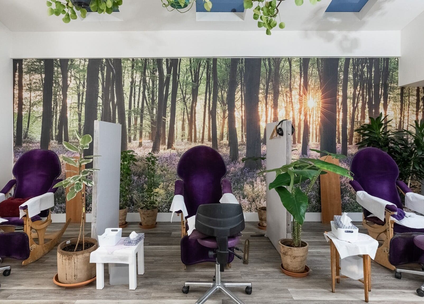 Relaxing spa chairs at Reflexions Bayswater, London, England, GB. A forest-themed beauty and wellness setting.