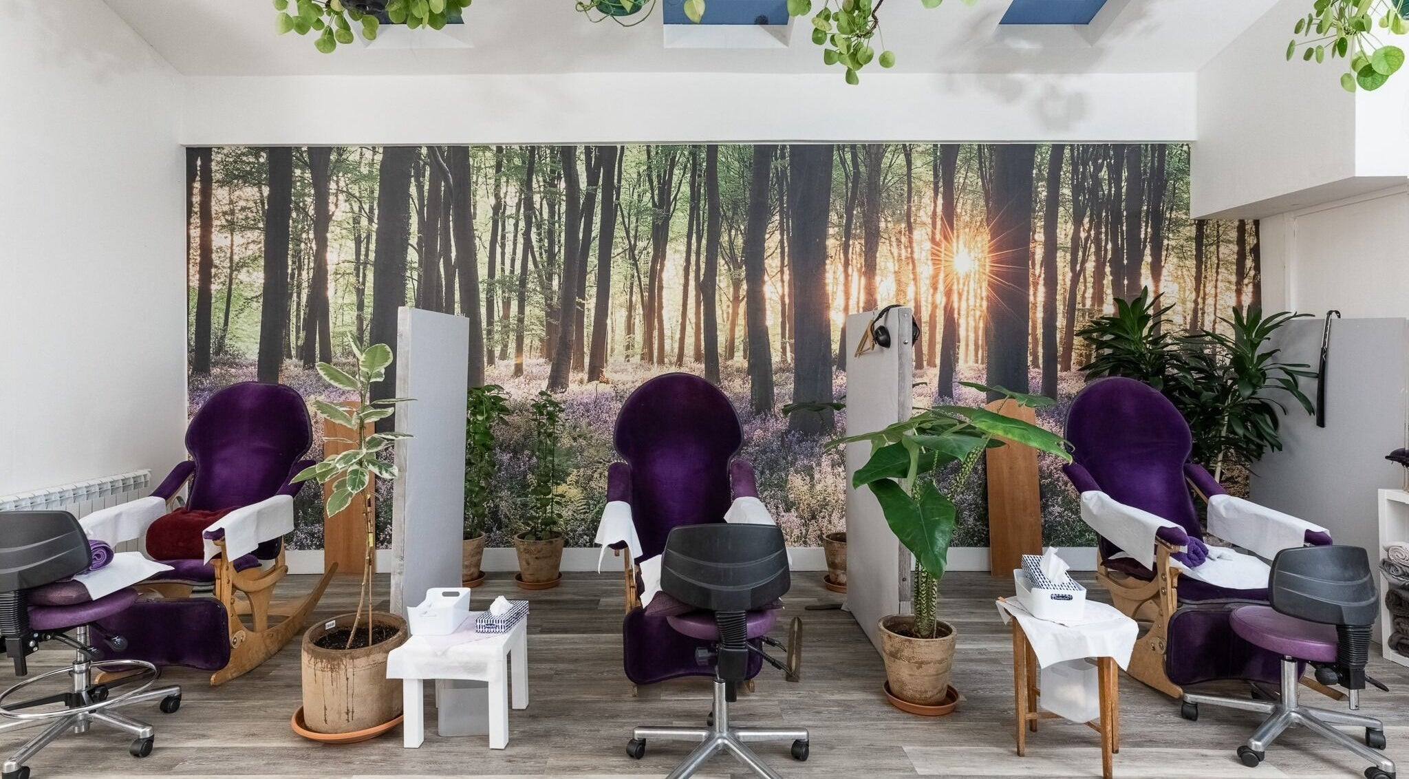 Relaxing spa chairs at Reflexions Bayswater, London, England, GB. A forest-themed beauty and wellness setting.