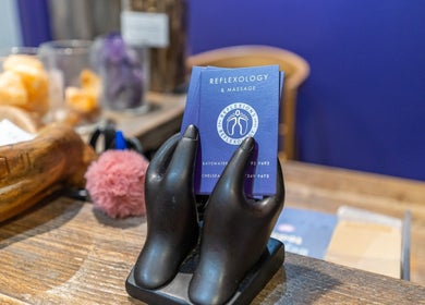 Business cards displayed at Reflexions Bayswater, London, England, GB. Inviting wellness atmosphere.