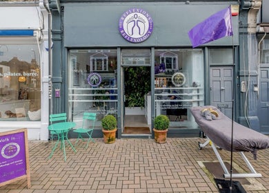 Reflexions Clapham located in London, England, GB showcasing entrance with chairs and potted plants.