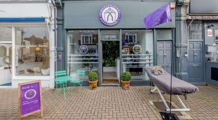 Reflexions Clapham located in London, England, GB showcasing entrance with chairs and potted plants.