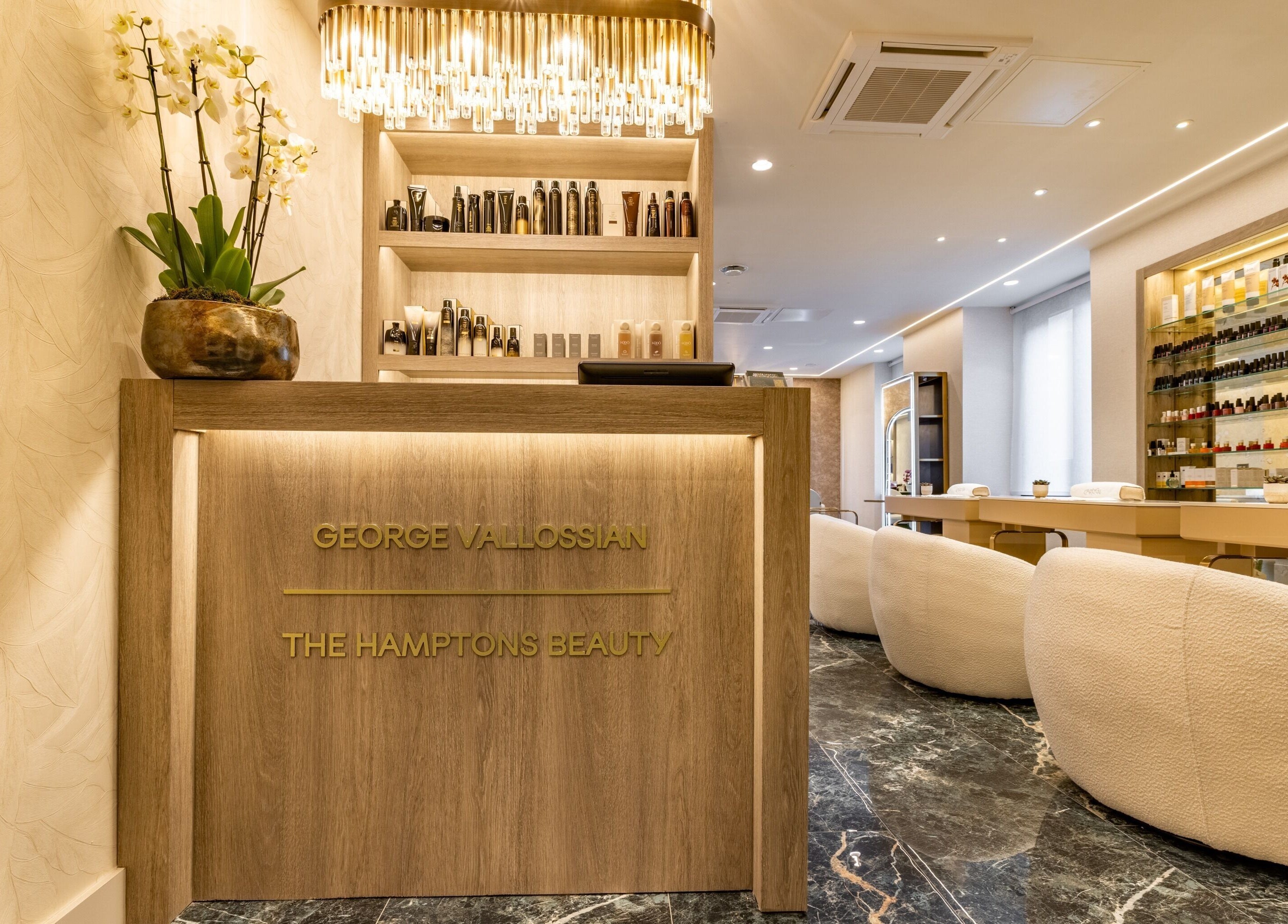 Elegant reception at The Hamptons Nails & Beauty, London, England, GB with chic decor and nail polish displays.