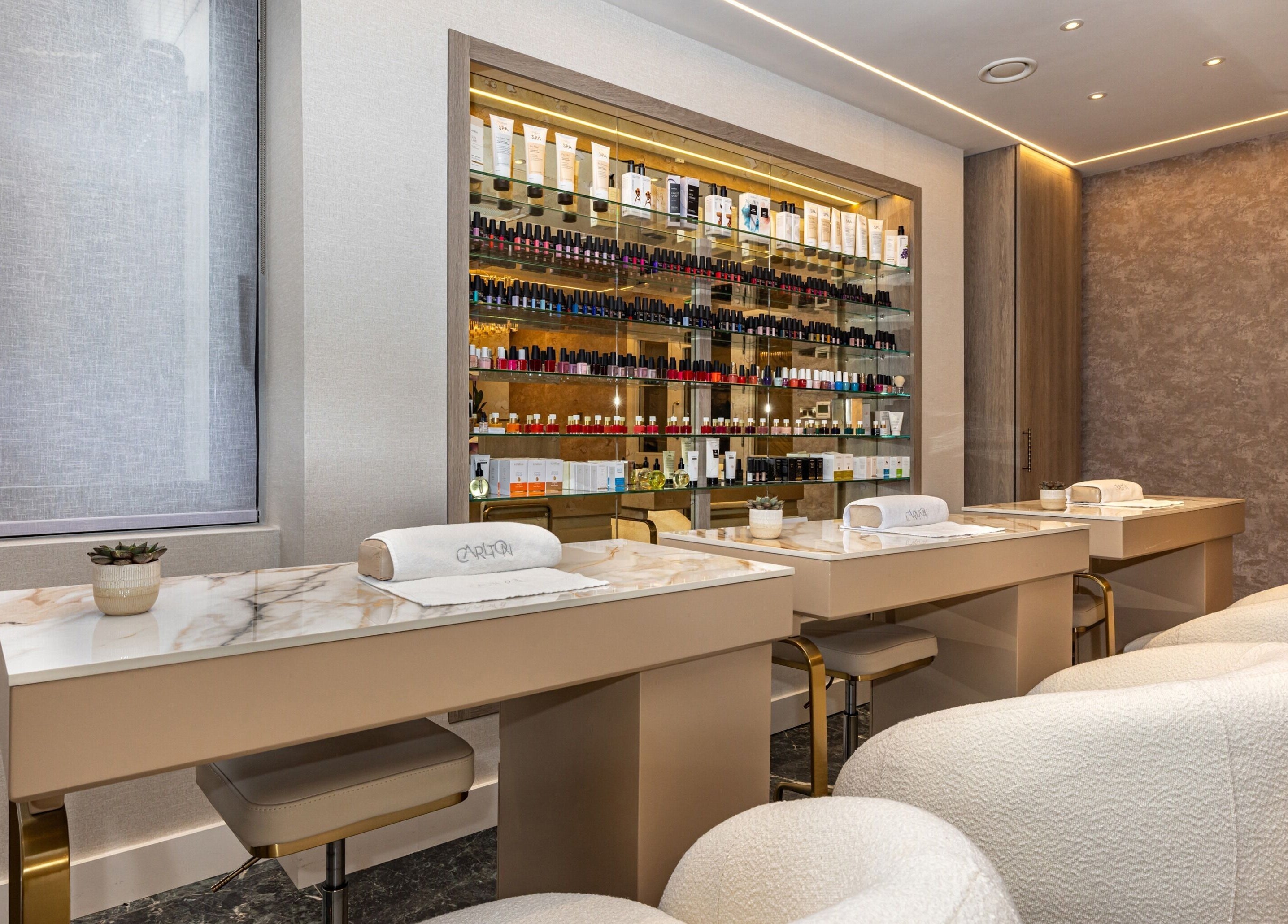 Luxurious manicure stations at The Hamptons Nails & Beauty in London, England, GB, featuring elegant decor.