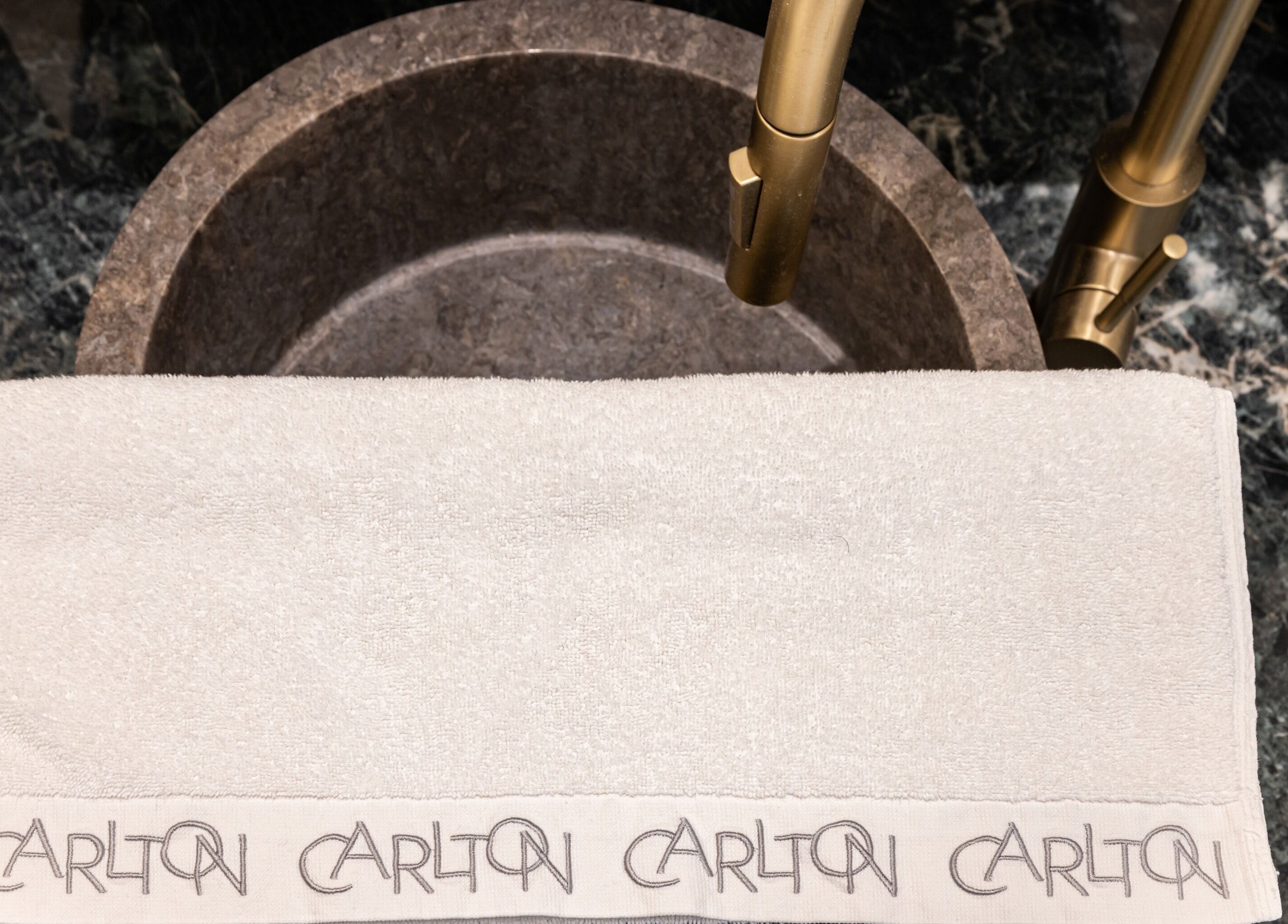 Luxurious sink and towel at The Hamptons Nails & Beauty in London, England, GB. Experience refined beauty services.