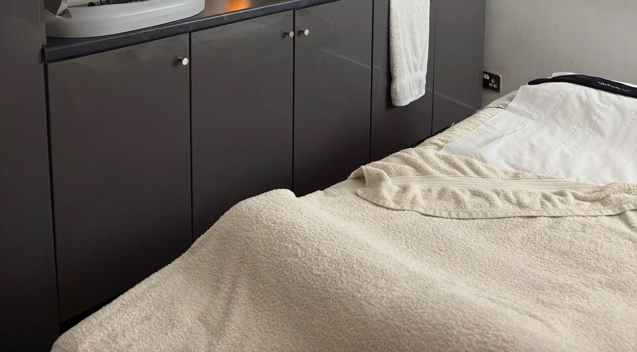 Massage bed in Ayanna Spa, London, England, GB, featuring soft towels and tranquil decor.