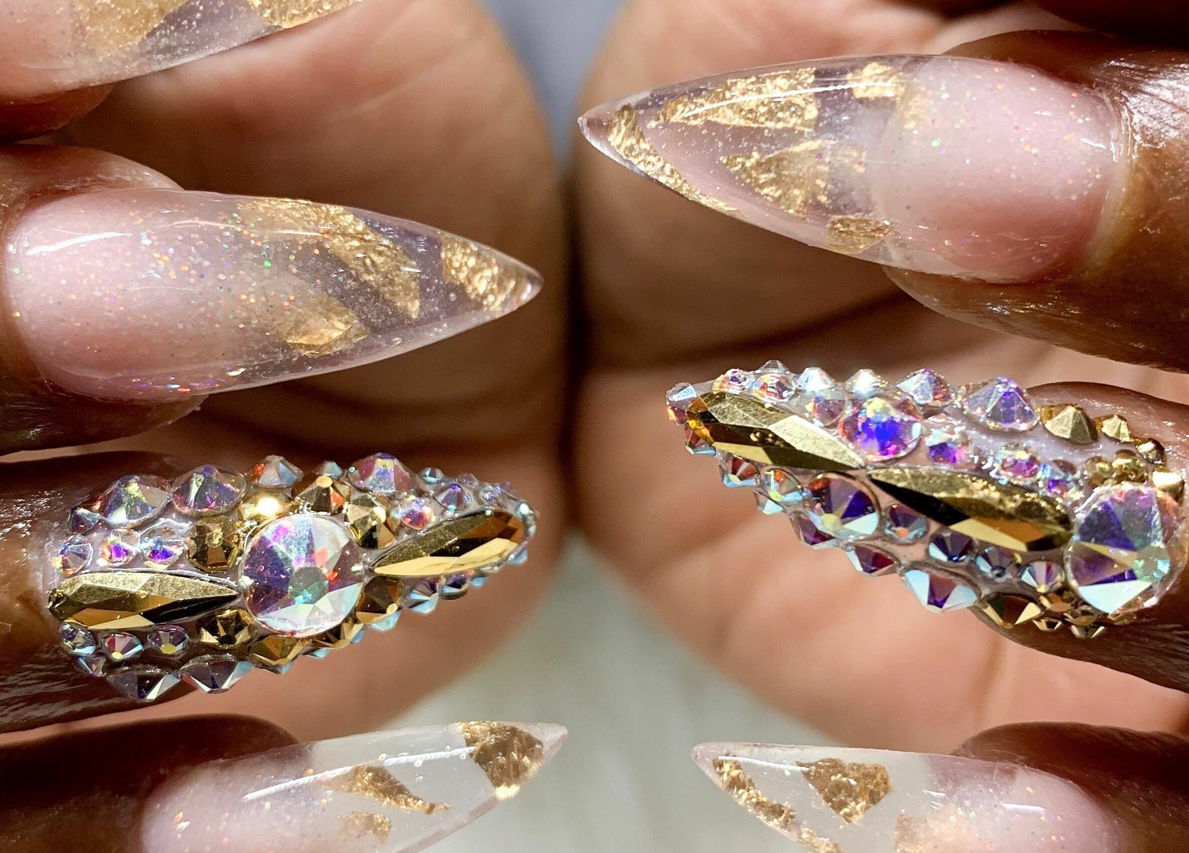 Exquisite gemstone nail art at The Nail Place, Evergreen Park, Illinois, US. Perfect for dazzling styles.